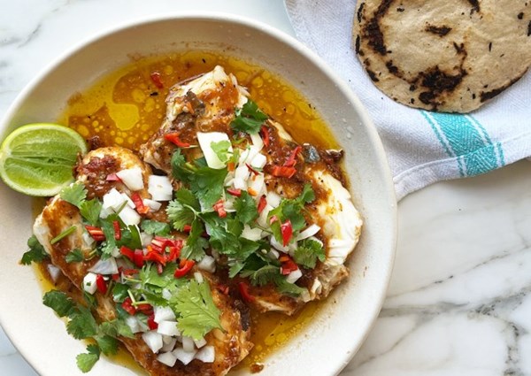 Slow-cooked hake in cascabel oil with corn tortillas