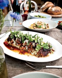 Slow-cooked leg of lamb with spiced yogurt and herbs