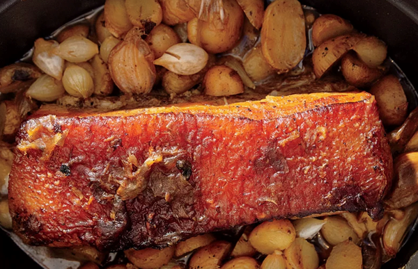 Slow-cooked pork belly with potatoes, onions, and garlic