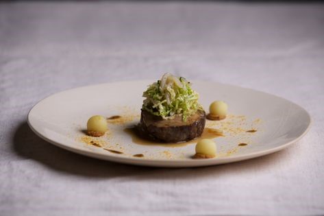 Slow-cooked pork neck, cuttlefish and cabbage salad with tonkotsu sauce [Michael Ryan]