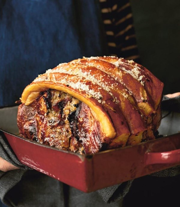 Slow-cooked pork shoulder stuffed with orange and prunes