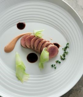 Slow-cooked pork tenderloin with quince purée, broccoli and prune sauce