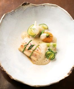 Slow-cooked rainbow trout with seasonal farm vegetables and chicory emulsion