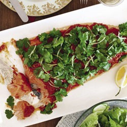 Slow-cooked salmon with spiced tomato sauce and coriander