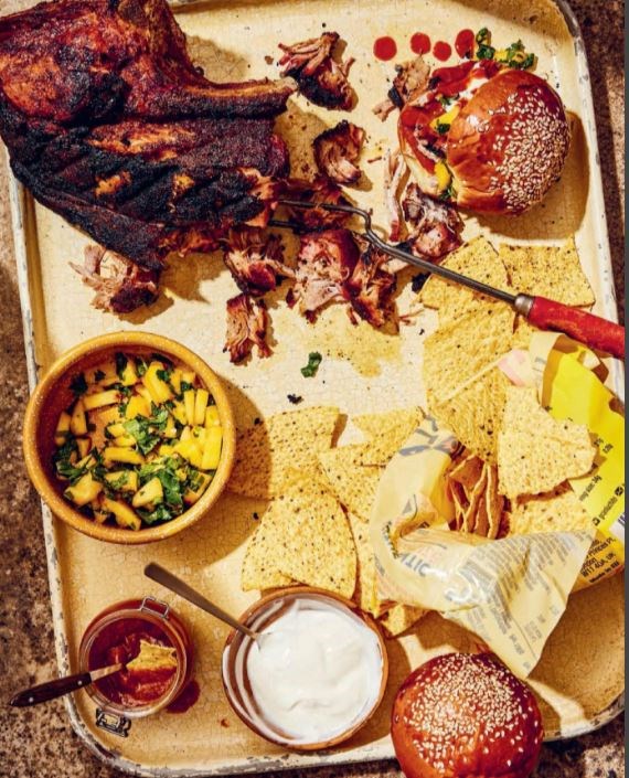 Slow-cooked shoulder of pork with peach salsa, peach barbecue sauce and tortilla chips