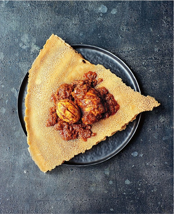 Slow-cooked spicy chicken with hard-boiled eggs (Doro wat)