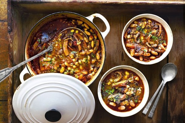 Slow-cooked squid with white beans, bacon and lemon