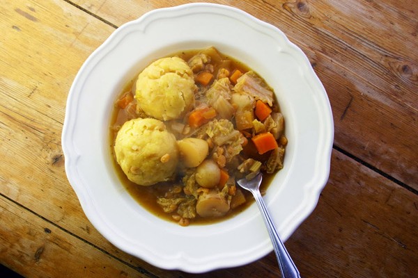 Slow-cooked vegetable and lentil stew with polenta dumplings 