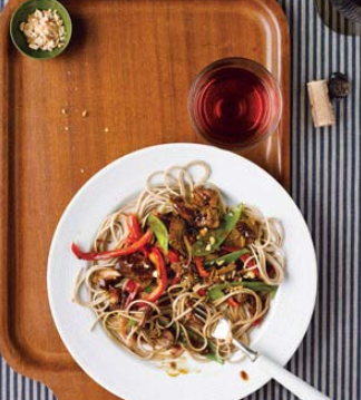 Slow-cooker Asian pork with snow peas, peppers, and noodles