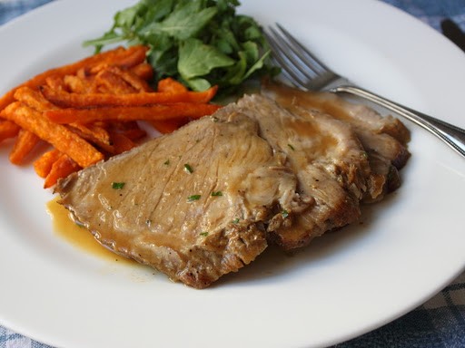 Slow cooker braised pork shoulder roast with apple butter sauce