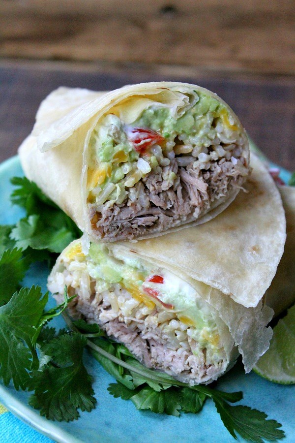 Slow cooker carnitas guacamole and rice burritos