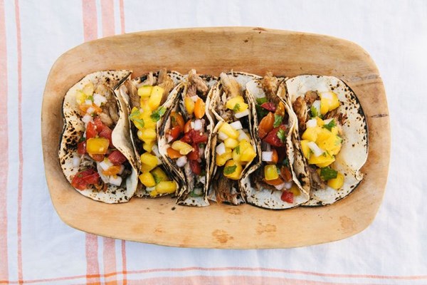 Slow cooker carnitas tacos with summer peach & tomato salsas 
