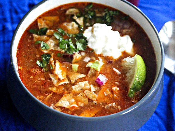 Slow cooker chicken tortilla soup with all the fixings