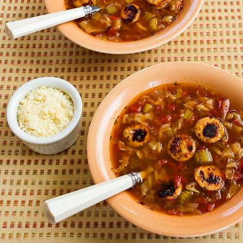 Slow cooker for cabbage soup with tomatoes, chicken-garlic sausage, and Parmesan