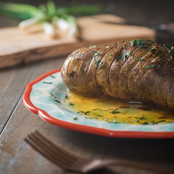 Slow cooker hasselback potatoes with honey-Sriracha butter