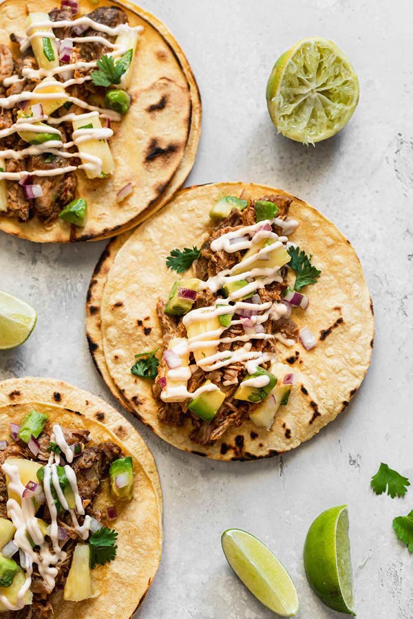 Slow cooker tacos al pastor [pineapple-avocado salsa, chipotle mayo]