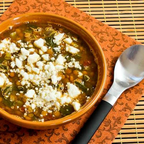 Slow cooker vegetarian Greek lentil soup with tomatoes, spinach, and feta