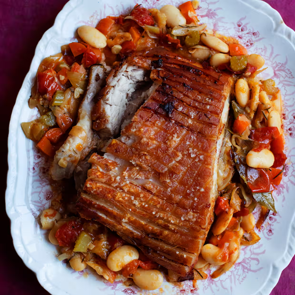 Slow roast belly pork with butter beans and balsamic vinegar