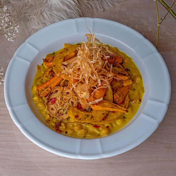 Slow-roast carrot and pumpkin, golden butter coconut chickpeas and parsnip crisps