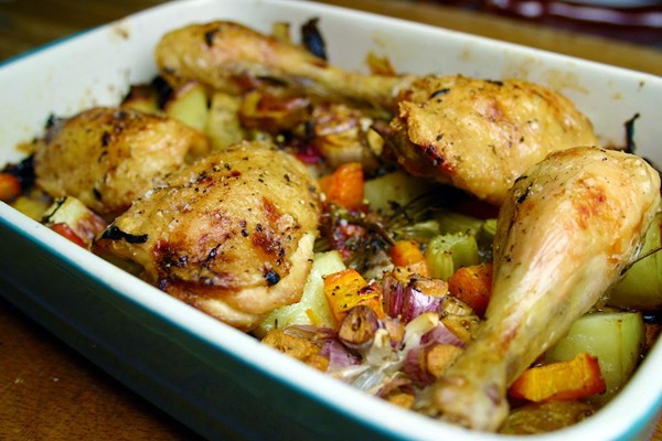 Slow roast chicken thighs with plums, carrots, potatoes, garlic and celery