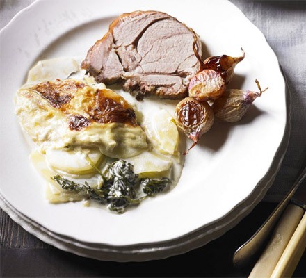 Slow-roast lamb with potato and spinach gratin