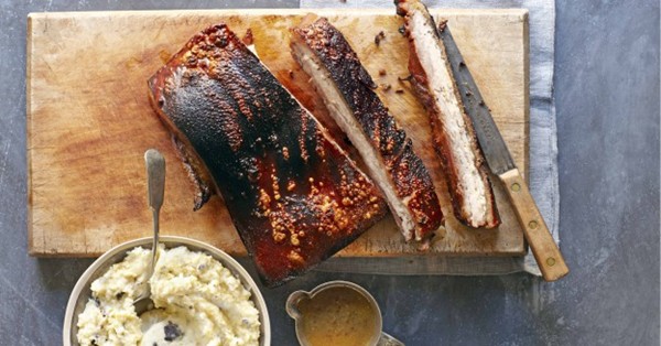 Slow-roast pork belly with black pudding mash and grain mustard sauce