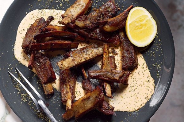 Slow-roasted lamb ribs with blood orange hummus