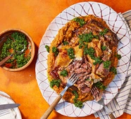 Slow-roasted mutton shoulder with garlic bean mash & gremolata