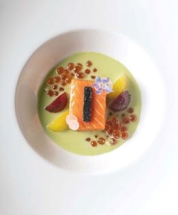 Slow-roasted ora king salmon with Comté cheese crust, braised beets, and Sicilian pistachio sauce