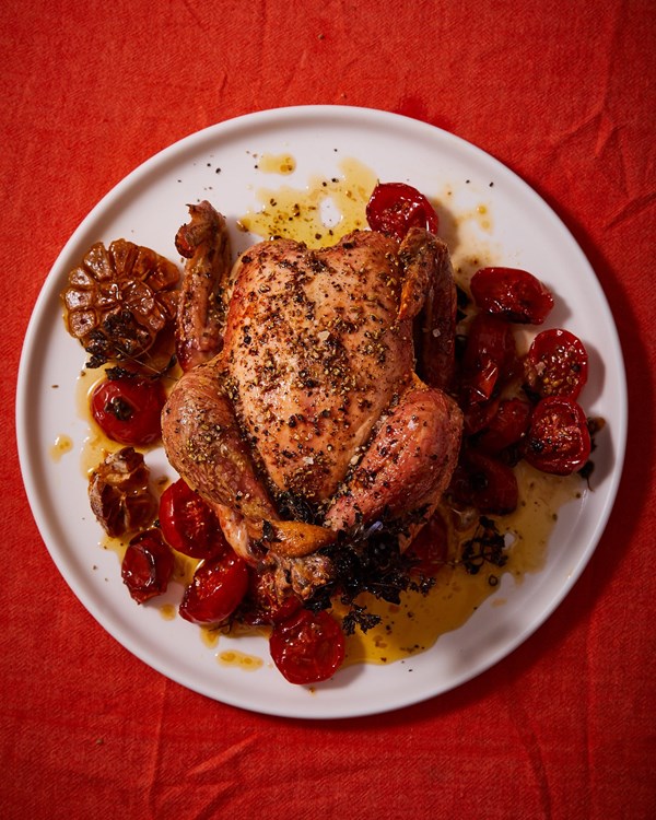 Slow-roasted oregano chicken with buttered tomatoes