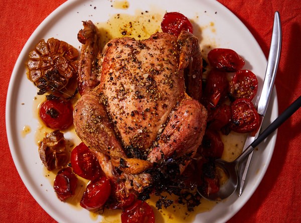Slow-roasted oregano chicken with buttered tomatoes
