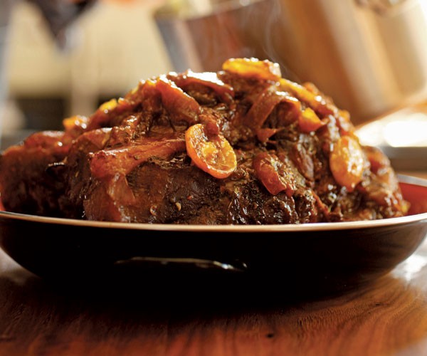 Slow-roasted pork shoulder with kumquats and chiles