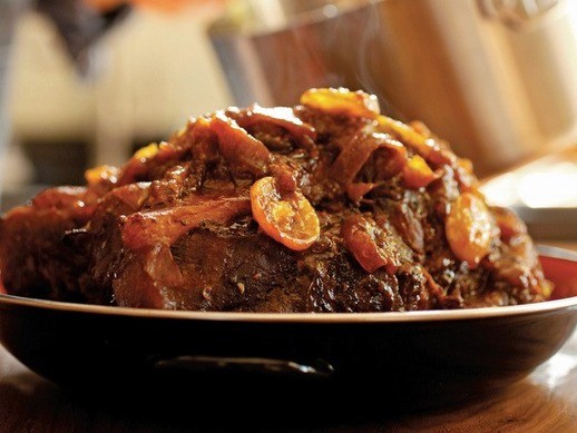 Slow-roasted pork shoulder with kumquats and chilies, from 'Down South' (Cook the Book)