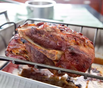 Slow-roasted pork shoulder with peach sauce
