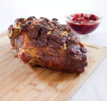 Slow-roasted pork shoulder with cherry sauce