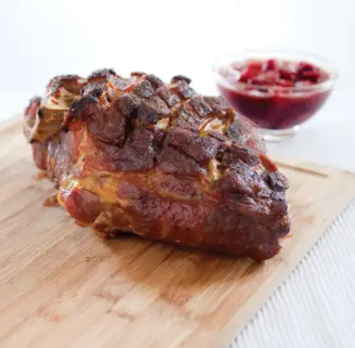 Slow-roasted pork shoulder with cherry sauce