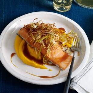 Slow-roasted salmon with soy-caramel sauce, carrot puree & crispy leeks