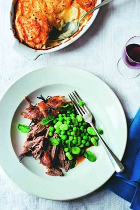 Slow-roasted shoulder of lamb with peas and broad beans