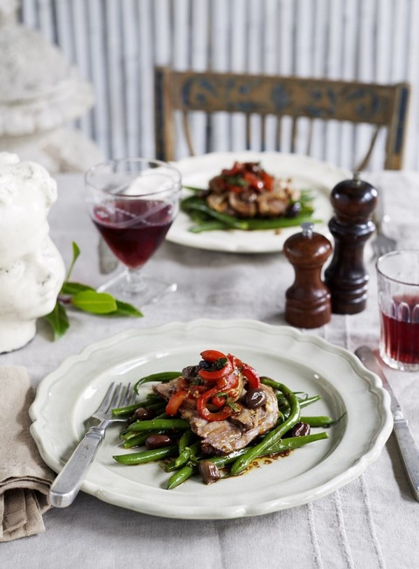 Slow roasted shoulder of lamb with warm tomato and black olive salad