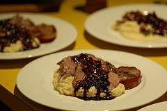 Slow roasted spiced lamb with pomegranate and saba sauce and cauliflower puree