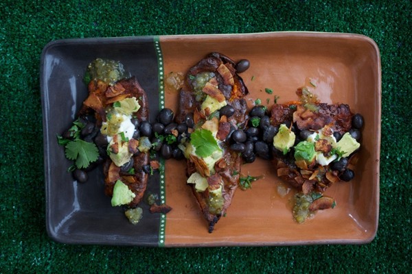 Smashed and loaded sweet potatoes with coconut bacon