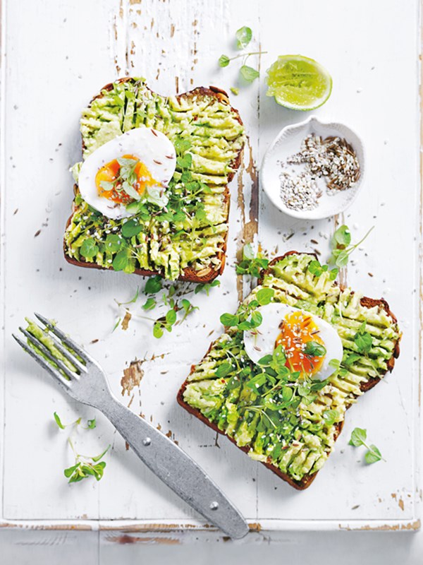 Smashed avocado toast with soft-boiled eggs