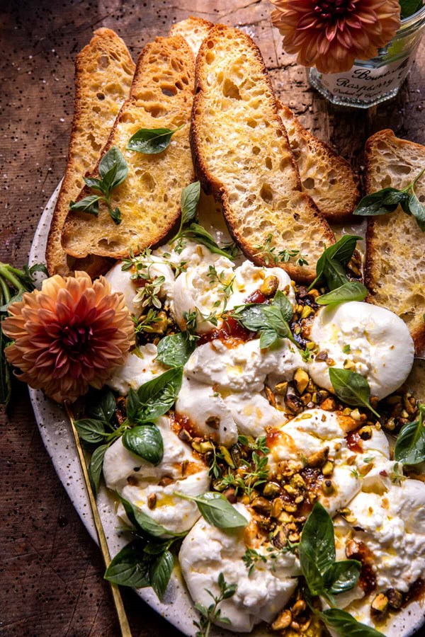 Smashed burrata with jam and pistachios