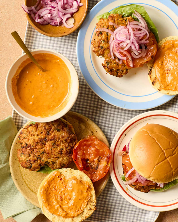 Smashed chicken burgers with harissa tahini