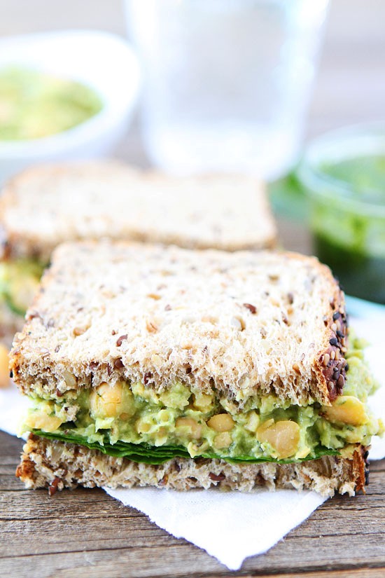 Smashed chickpea, avocado, and pesto salad sandwich
