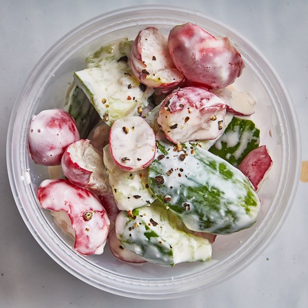 Smashed cucumbers and radishes in yogurt sauce