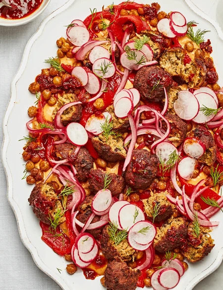 Smashed falafel platter with pink pickled onions