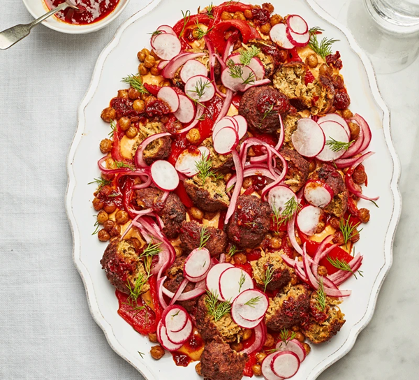 Smashed falafel platter with pink pickled onions