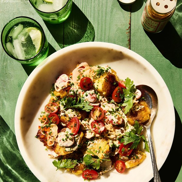 Smashed potato salad with cherry tomatoes and roasted peppers 