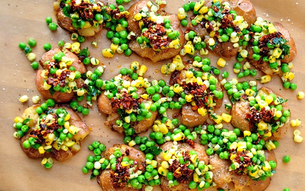 Smashed potatoes, peas, and corn with chile-garlic oil